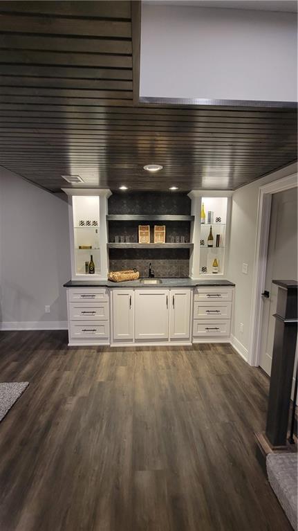 16570 W 170th St, Olathe, KS 66062 - indoor bar featuring baseboards and dark wood finished floors