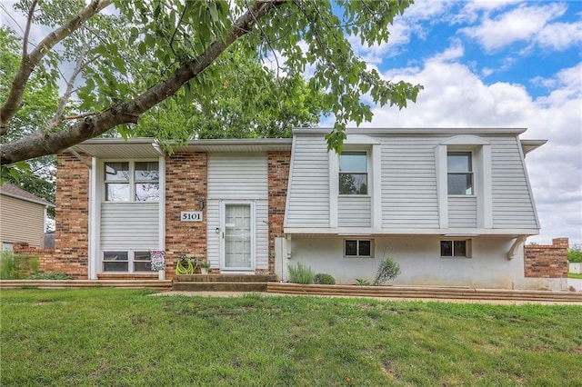 5101 NW Downing St, Blue Springs, MO 64015 - view of front of property featuring a front lawn and brick siding