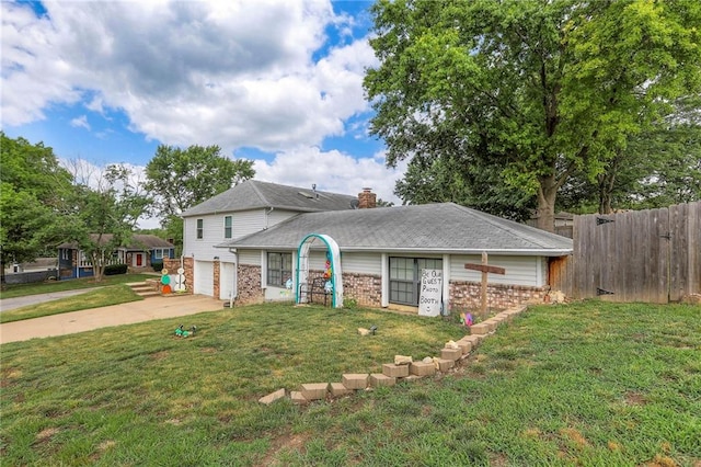 5101 NW Downing St, Blue Springs, MO 64015 - view of front of property with brick siding, concrete driveway, a garage, and a chimney