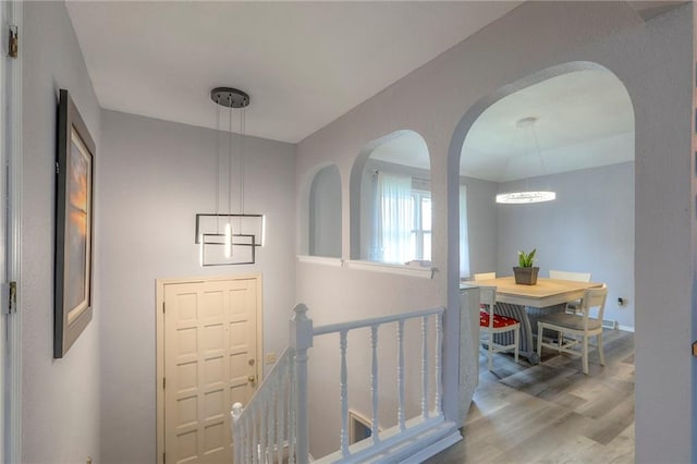 5101 NW Downing St, Blue Springs, MO 64015 - entryway with wood finished floors, arched walkways, and a chandelier