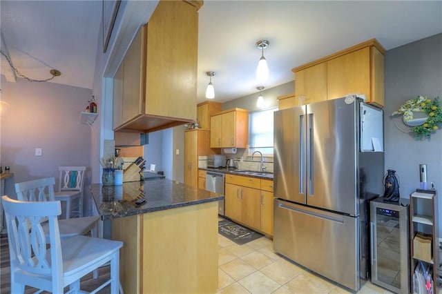 5101 NW Downing St, Blue Springs, MO 64015 - kitchen with stainless steel appliances, beverage cooler, a peninsula, light tile patterned floors, and dark stone counters