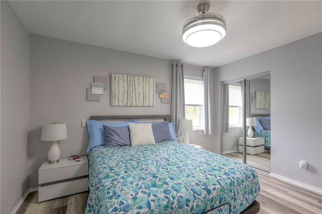 5101 NW Downing St, Blue Springs, MO 64015 - bedroom with wood finished floors and a closet