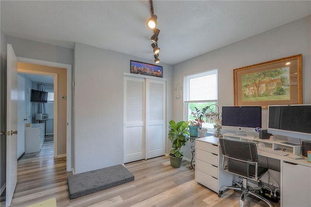 5101 NW Downing St, Blue Springs, MO 64015 - home office featuring light wood-style floors and rail lighting