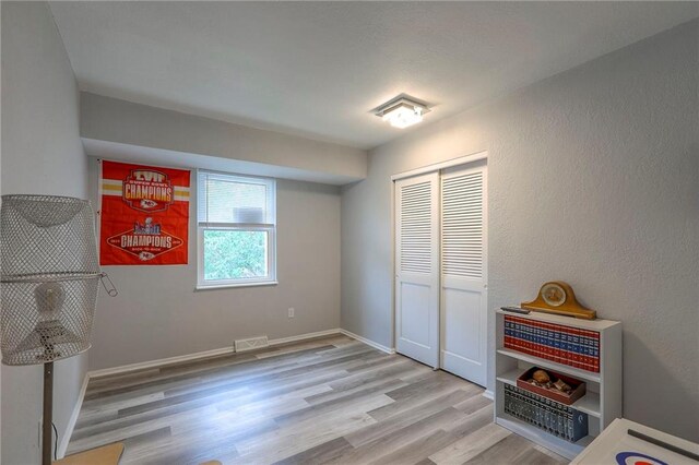 5101 NW Downing St, Blue Springs, MO 64015 - unfurnished bedroom with wood finished floors and a closet