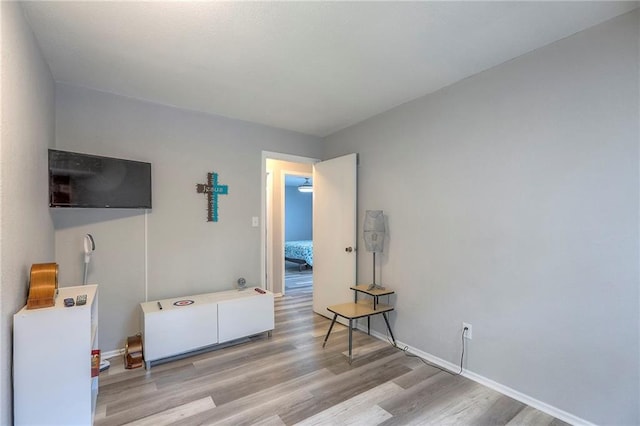 5101 NW Downing St, Blue Springs, MO 64015 - living area with wood finished floors and baseboards