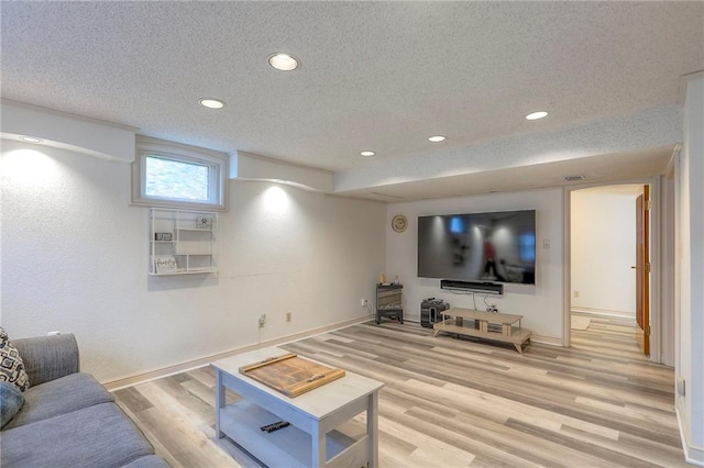 5101 NW Downing St, Blue Springs, MO 64015 - living room with light wood-type flooring, a textured ceiling, and recessed lighting