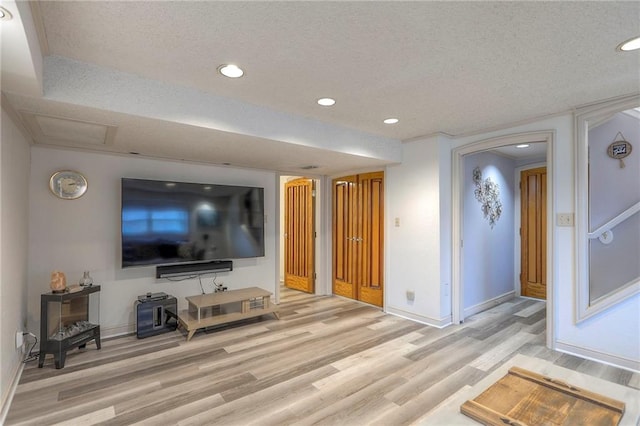 5101 NW Downing St, Blue Springs, MO 64015 - living area with light wood finished floors, a textured ceiling, and recessed lighting