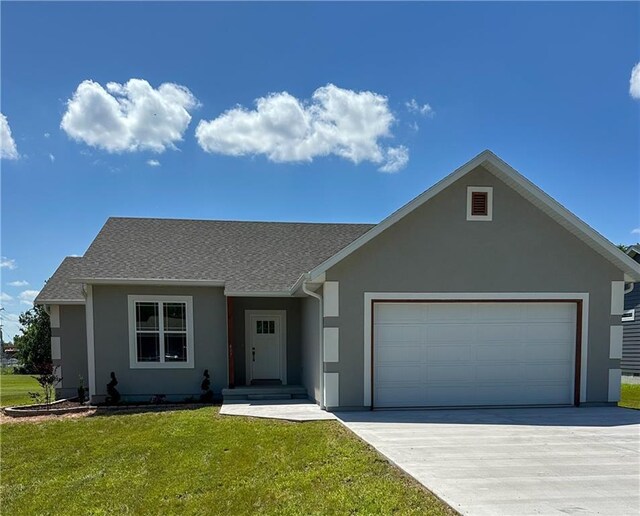 407 N Harmon St, Girard, KS 66743 - single story home with a garage, stucco siding, concrete driveway, a front yard, and a shingled roof