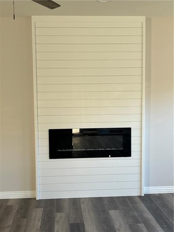 407 N Harmon St, Girard, KS 66743 - detailed view of wood finished floors and a large fireplace