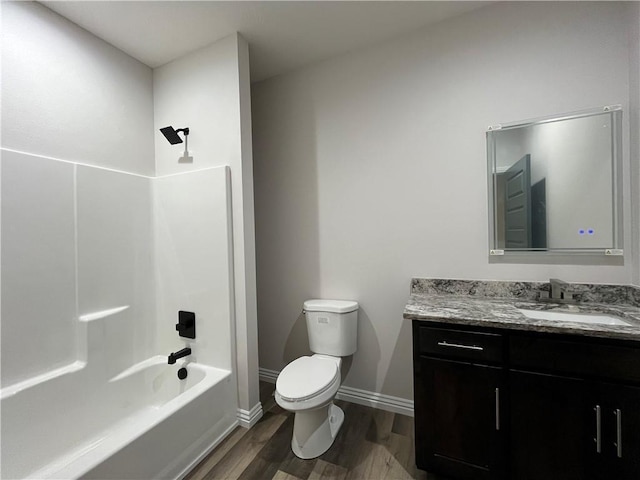 407 N Harmon St, Girard, KS 66743 - bathroom featuring vanity, wood finished floors, and shower / bath combination