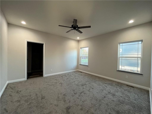 407 N Harmon St, Girard, KS 66743 - carpeted empty room with recessed lighting and a ceiling fan