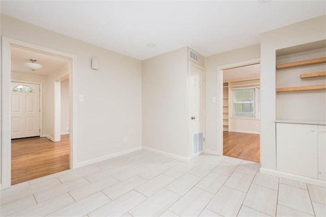 627 E Meyer Blvd, Kansas City, MO 64131 - spare room with baseboards and light wood finished floors