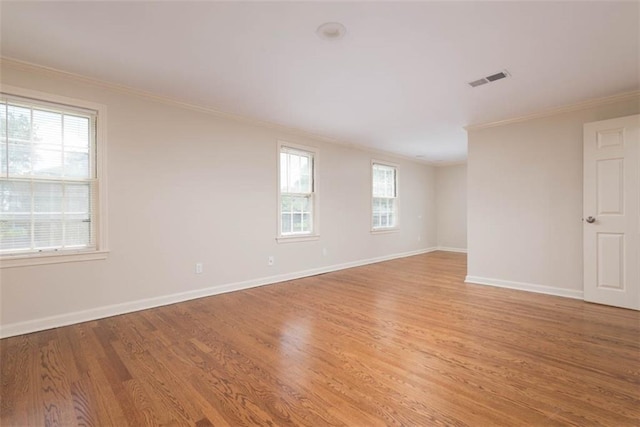 627 E Meyer Blvd, Kansas City, MO 64131 - empty room with ornamental molding and light wood-style flooring