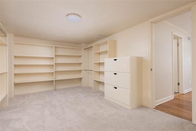 627 E Meyer Blvd, Kansas City, MO 64131 - walk in closet featuring light carpet