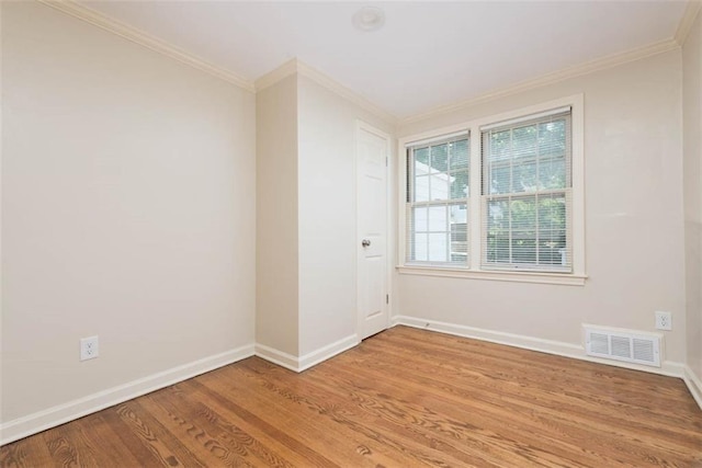 627 E Meyer Blvd, Kansas City, MO 64131 - spare room featuring light wood-type flooring and crown molding