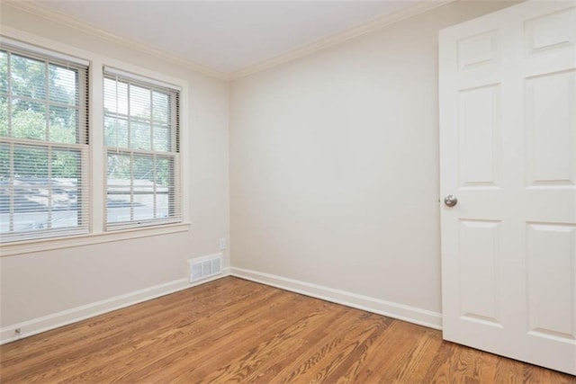 627 E Meyer Blvd, Kansas City, MO 64131 - unfurnished room with light wood-style floors and crown molding
