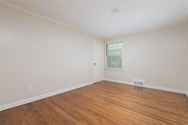 627 E Meyer Blvd, Kansas City, MO 64131 - spare room with crown molding and wood finished floors