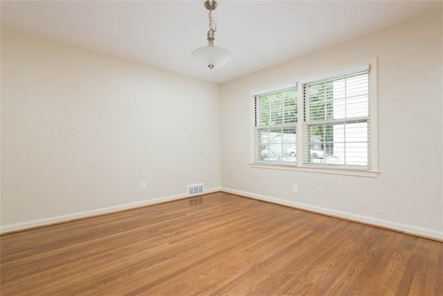 627 E Meyer Blvd, Kansas City, MO 64131 - empty room featuring wood finished floors and baseboards