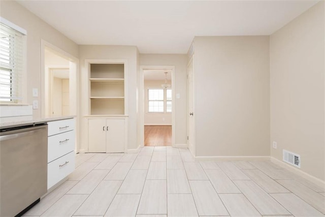 627 E Meyer Blvd, Kansas City, MO 64131 - kitchen featuring dishwasher, white cabinetry, light countertops, and a chandelier
