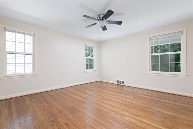 627 E Meyer Blvd, Kansas City, MO 64131 - unfurnished room featuring light wood finished floors and ceiling fan