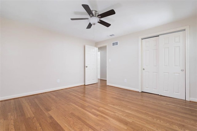 627 E Meyer Blvd, Kansas City, MO 64131 - unfurnished bedroom with light wood-style floors, a closet, and a ceiling fan