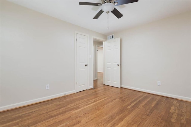 627 E Meyer Blvd, Kansas City, MO 64131 - spare room featuring light wood finished floors and ceiling fan