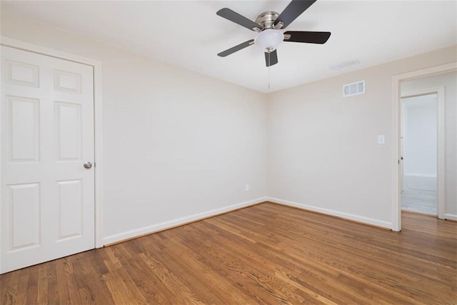 627 E Meyer Blvd, Kansas City, MO 64131 - spare room with wood finished floors and a ceiling fan