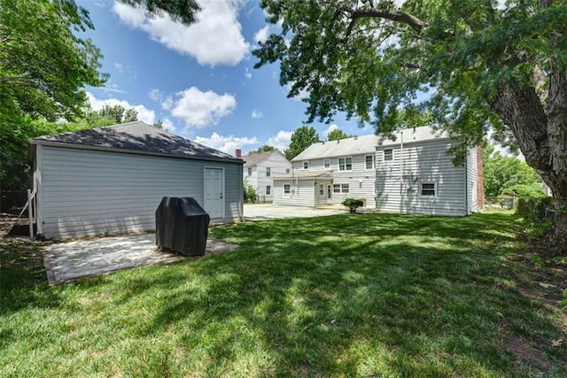 627 E Meyer Blvd, Kansas City, MO 64131 - rear view of house with a patio, a lawn, and a chimney