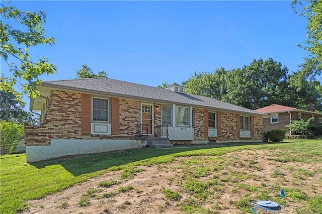 8315 Laurel Ave, Raytown, MO 64138 - ranch-style house featuring a front lawn and brick siding