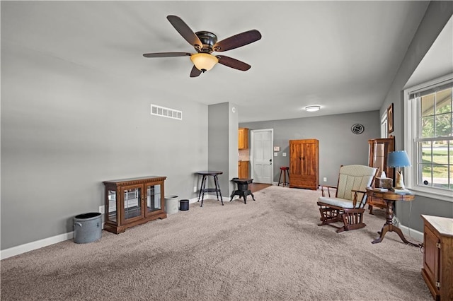 8315 Laurel Ave, Raytown, MO 64138 - living area with carpet and ceiling fan