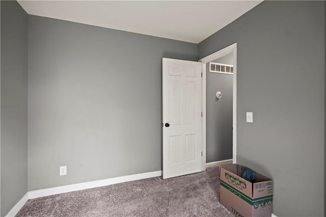 8315 Laurel Ave, Raytown, MO 64138 - unfurnished bedroom featuring carpet floors and baseboards