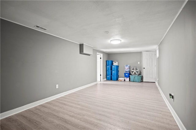 8315 Laurel Ave, Raytown, MO 64138 - finished below grade area featuring wood finished floors and crown molding