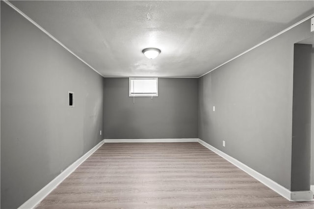 8315 Laurel Ave, Raytown, MO 64138 - below grade area with a textured ceiling and wood finished floors
