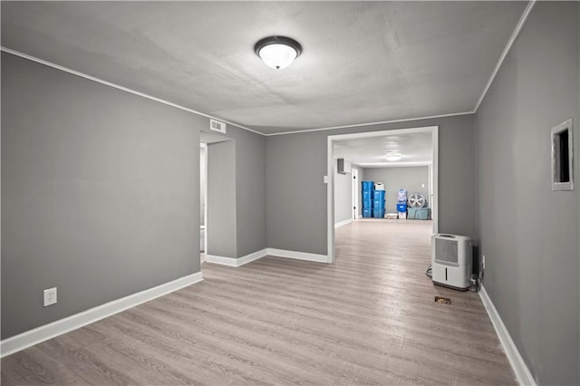 8315 Laurel Ave, Raytown, MO 64138 - spare room featuring wood finished floors and a textured ceiling