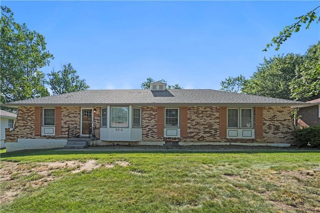 8315 Laurel Ave, Raytown, MO 64138 - ranch-style home featuring brick siding and a front yard