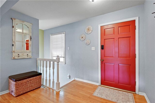 1211 SW Walnut St, Lees Summit, MO 64081 - foyer entrance with wood finished floors and baseboards