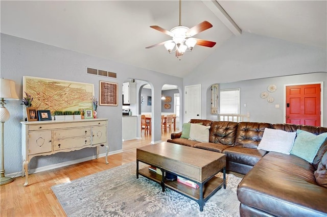 1211 SW Walnut St, Lees Summit, MO 64081 - living room with arched walkways, ceiling fan, beamed ceiling, light wood-style flooring, and high vaulted ceiling