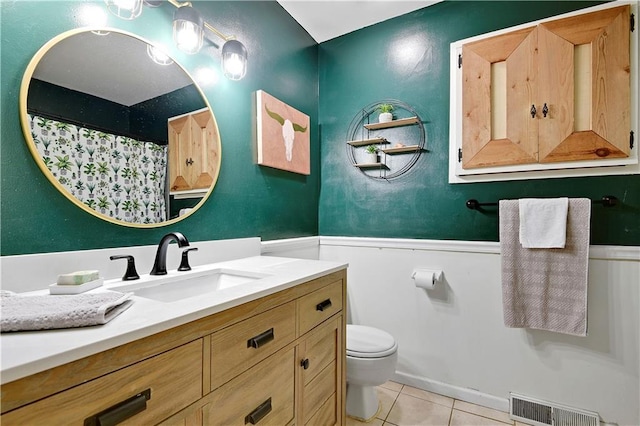 1211 SW Walnut St, Lees Summit, MO 64081 - full bath with wainscoting, vanity, tile patterned floors, and curtained shower
