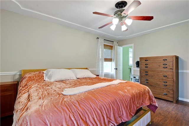1211 SW Walnut St, Lees Summit, MO 64081 - bedroom with dark wood-style floors and a ceiling fan