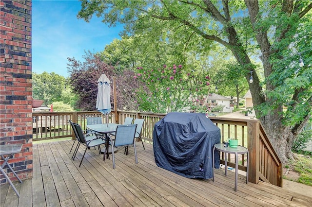 1211 SW Walnut St, Lees Summit, MO 64081 - wooden terrace featuring outdoor dining area and grilling area