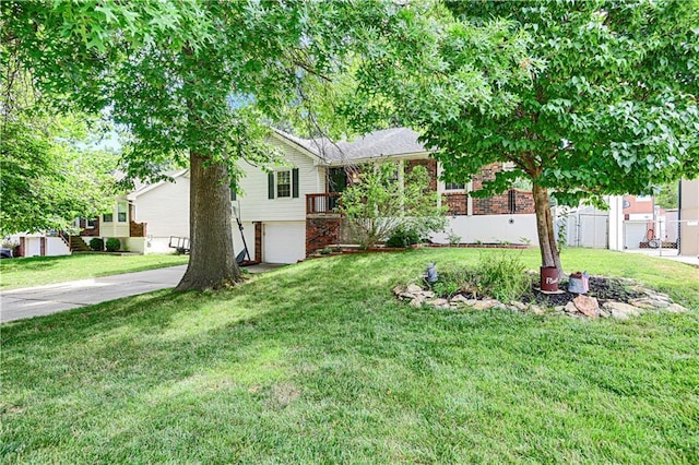 1211 SW Walnut St, Lees Summit, MO 64081 - view of front of property with a garage, concrete driveway, and brick siding