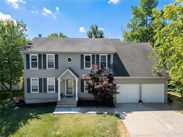 2623 W 131st St, Olathe, KS 66061 - colonial home with concrete driveway, a front lawn, and a shingled roof
