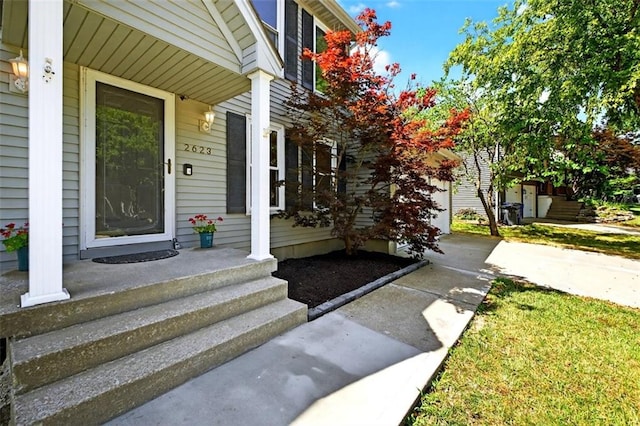 2623 W 131st St, Olathe, KS 66061 - property entrance featuring covered porch and concrete driveway