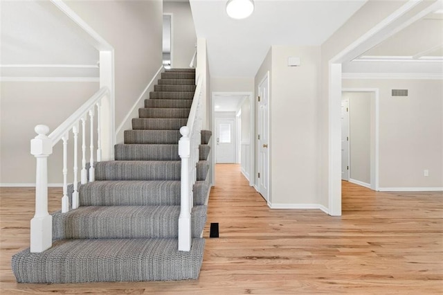 2623 W 131st St, Olathe, KS 66061 - stairs with wood finished floors and crown molding