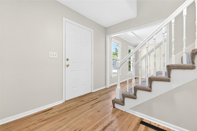 2623 W 131st St, Olathe, KS 66061 - foyer with wood finished floors and stairway