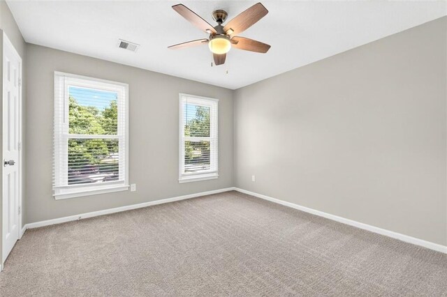 2623 W 131st St, Olathe, KS 66061 - carpeted spare room featuring baseboards and a ceiling fan