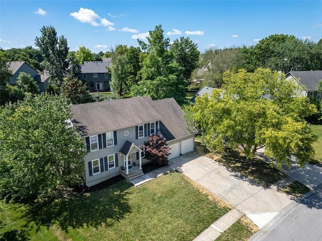 2623 W 131st St, Olathe, KS 66061 - view of subject property featuring a tree filled landscape