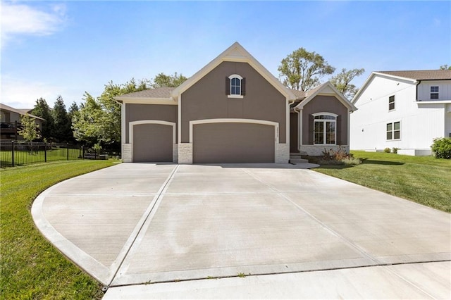 25313 W 142nd Pl, Olathe, KS 66061 - view of front of property with stucco siding, driveway, stone siding, and an attached garage