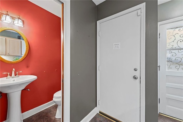 1296 W 72nd Ter, Kansas City, MO 64114 - half bath featuring toilet and baseboards