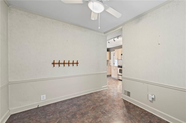 1296 W 72nd Ter, Kansas City, MO 64114 - spare room featuring a ceiling fan and baseboards